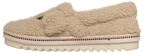 A slip-on shoe with a beige sherpa-style fabric upper that resembles a cartoon animal face, set atop a thick, white, ridged rubber platform sole with a decorative pink and black trim border.