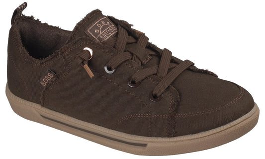 A brown canvas sneaker with a frayed edge design, laces, and a light brown rubber sole, featuring a BOBS logo tag on the side and a BOBS from Skechers label on the tongue.