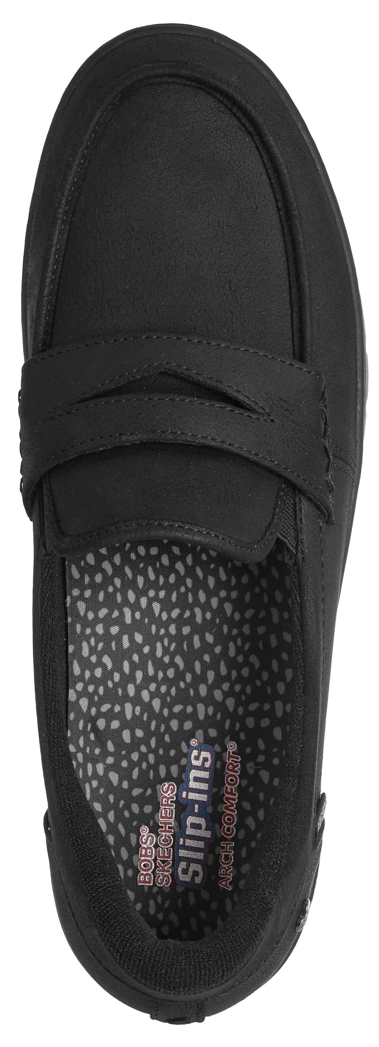 A black slip-on loafer shoe viewed from above, featuring a moc-toe design, a decorative strap across the vamp, and a patterned inner sole with the text 'Skechers slip-ins' and 'Arch Fit' visible.