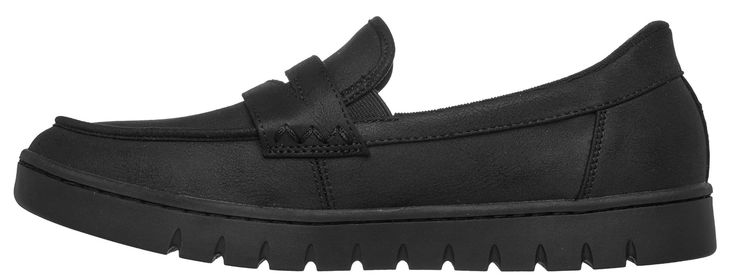 A black slip-on loafer with a moc-toe construction, a classic penny strap detail across the vamp, and a thick, ridged rubber platform sole.