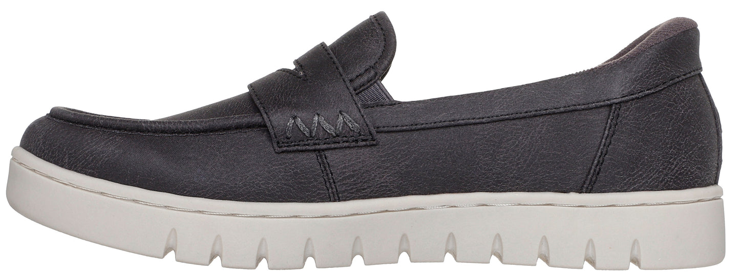 A dark gray women's leather loafer shoe with a thick, white, textured rubber lug sole, featuring a saddle strap across the instep with decorative stitching.