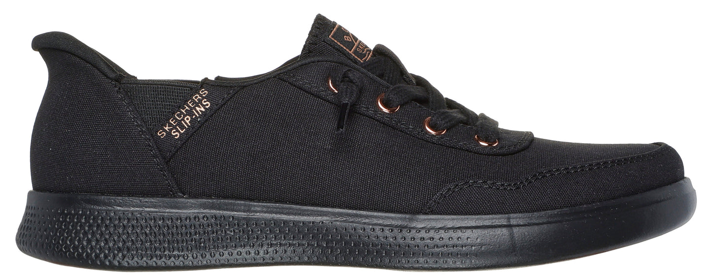 A low-rise black sneaker with dark laces and a textured sole.