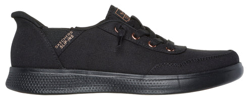 A low-rise black sneaker with dark laces and a textured sole.