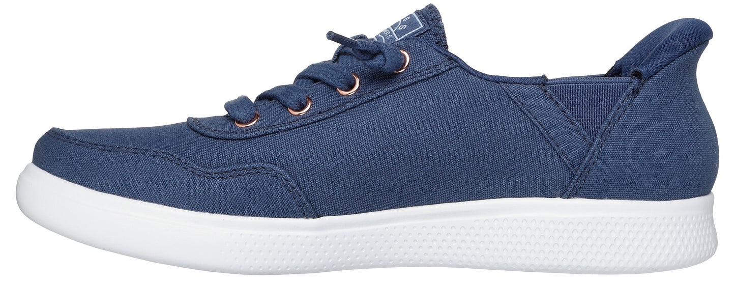 A navy canvas sneaker with a white sole.
