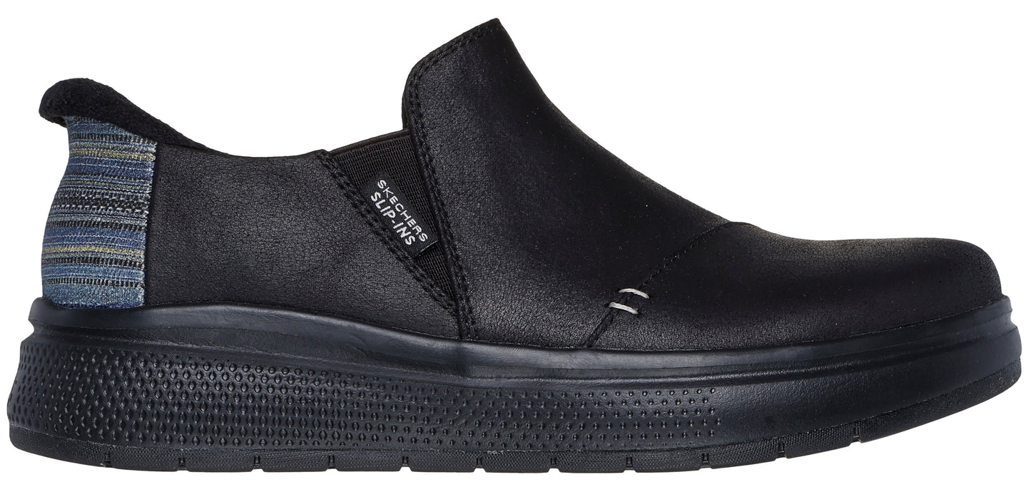 Black slip-on shoe with textured heel and thick sole.