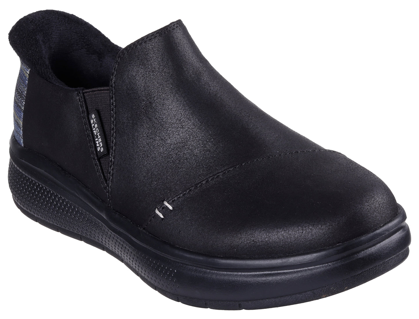 Black slip-on shoe with a low heel and a plaid panel near the heel.