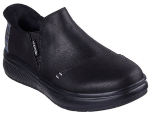 Black slip-on shoe with a low heel and a plaid panel near the heel.