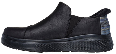 A black slip-on shoe with a thick sole and a striped fabric panel on the heel.