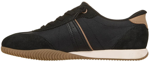 A low-top, black athletic sneaker with a gum-colored ridged rubber outsole, a white midsole, and tan accents on the heel and side.