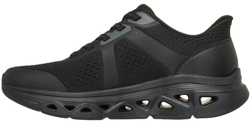 A black athletic sneaker with a mesh upper, synthetic overlays, and a thick, chunky midsole featuring multiple geometric cutout details.