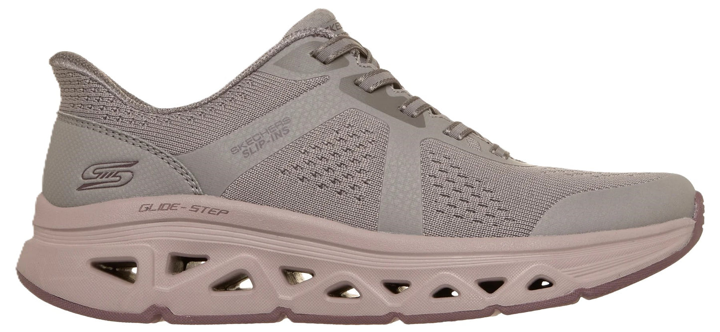 A light gray women's athletic sneaker with a lace-up front, mesh upper, and a distinct, thick, geometric-cutout midsole labeled GLIDE-STEP.