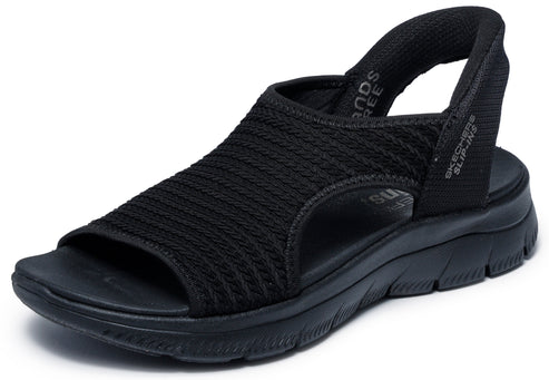 A black sandal with elastic straps, an open toe, and visible text that reads 'SLIP-INS' on the heel.