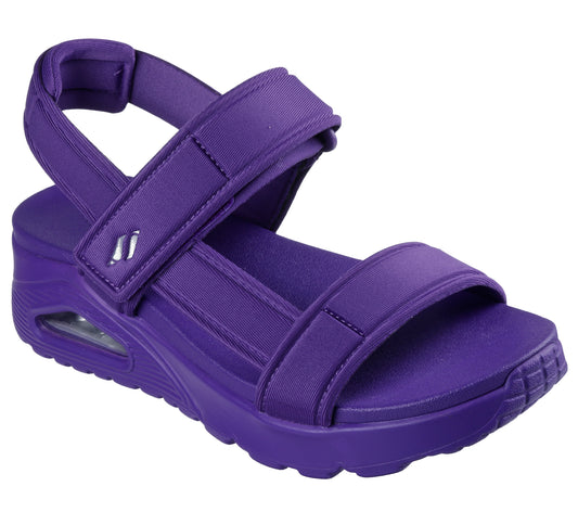 Purple sandal with adjustable straps and visible air cushioning in the heel.