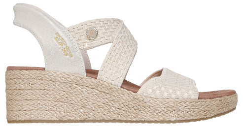 Womens off-white wedge sandal with woven crisscross straps and elastic ankle strap.