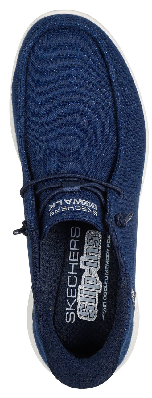 Overhead studio shot of a blue slip-on shoe with white sole.