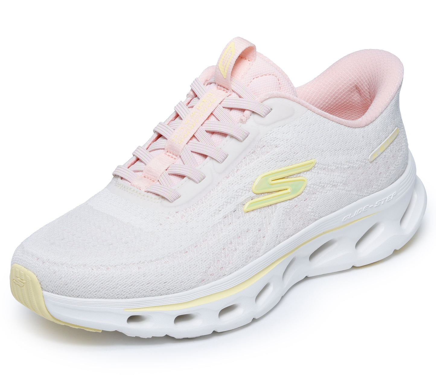 Pink athletic shoe with white sole and yellow accents.