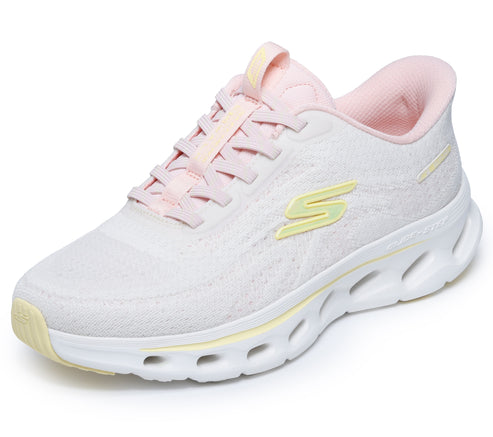Pink athletic shoe with white sole and yellow accents.