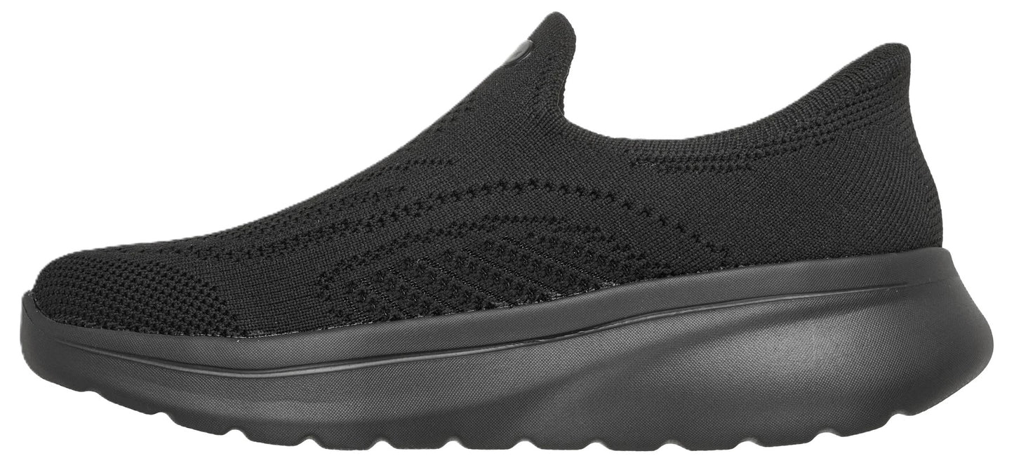 A sleek, black, slip-on athletic shoe with a breathable knit fabric upper and a chunky, cushioned monochromatic sole.