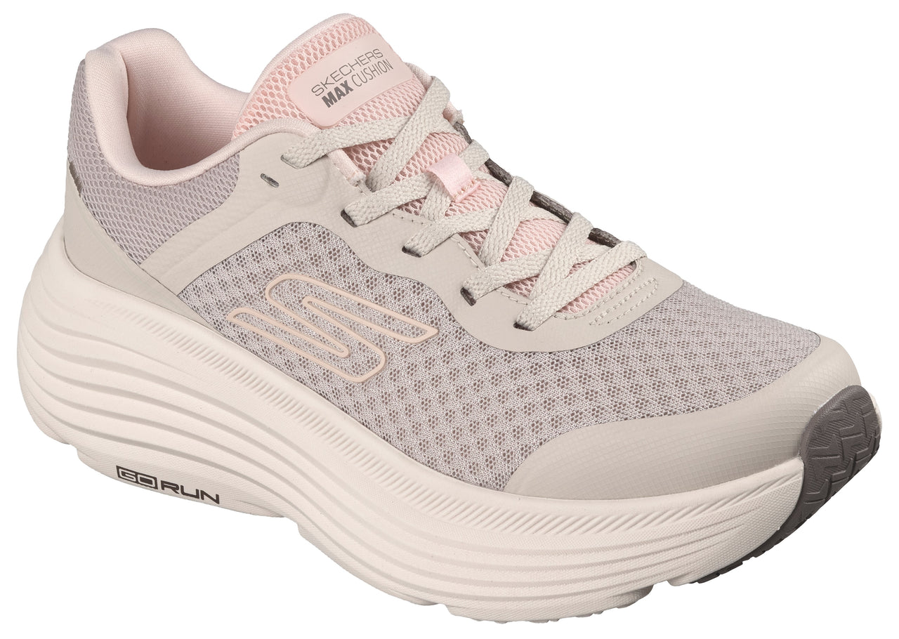 Running shoe with a thick, ridged sole, light gray mesh upper, pink laces and "SKECHERS MAX CUSHION" text on the tongue.