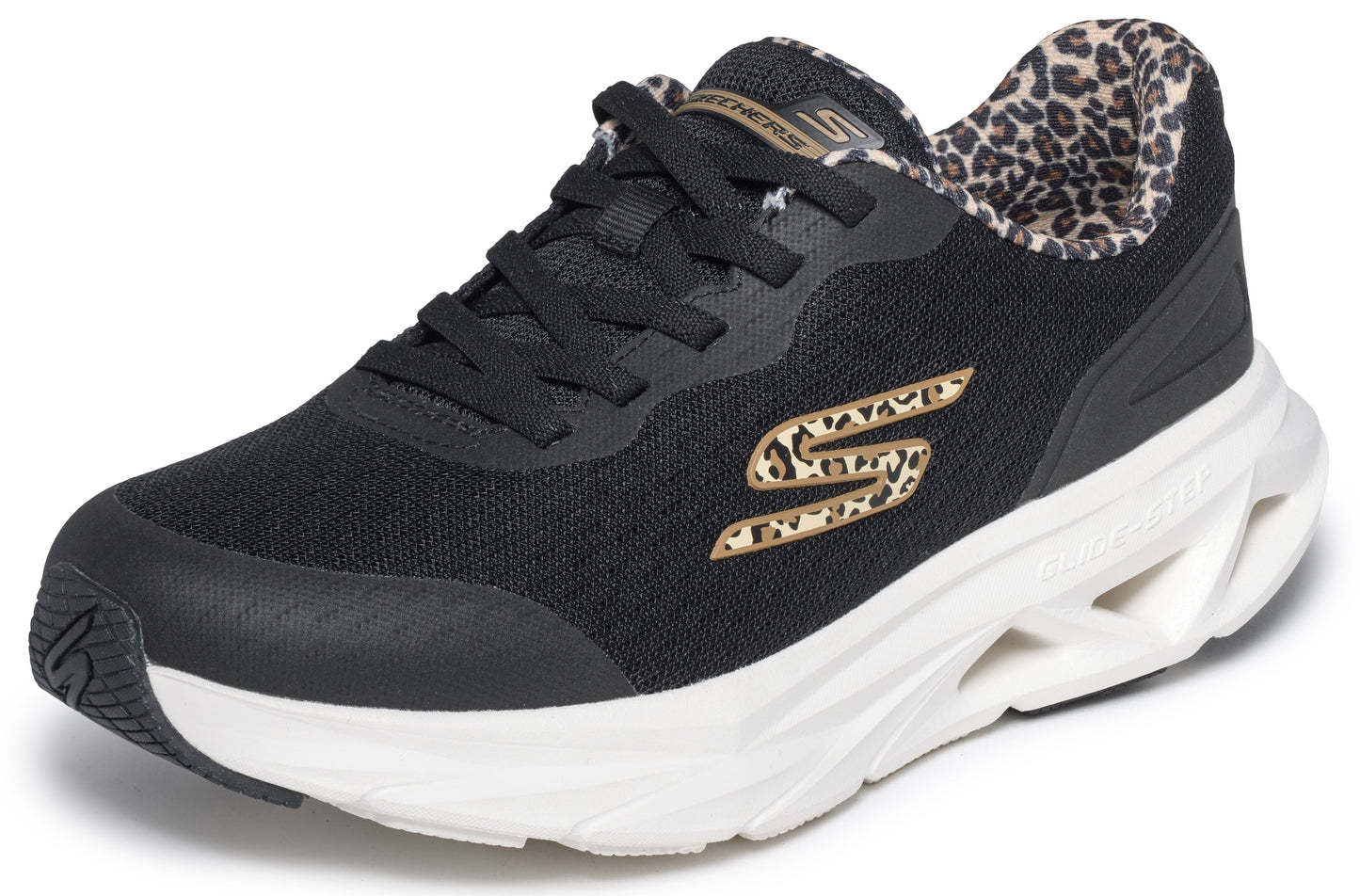 A black Skechers athletic sneaker with black laces, a white cushioned midsole with a segmented design, a leopard print lining, and a leopard print 'S' logo on the side.