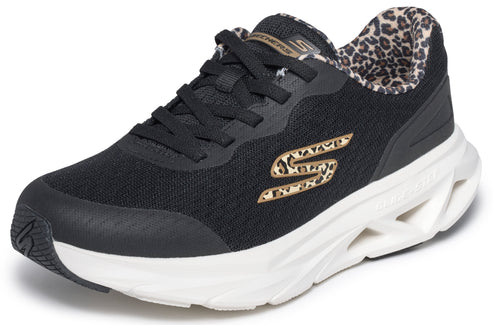 A black Skechers athletic sneaker with black laces, a white cushioned midsole with a segmented design, a leopard print lining, and a leopard print 'S' logo on the side.