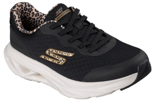 A black Skechers athletic sneaker with a thick white sculpted midsole, featuring a leopard-print lining at the collar and a leopard-print 'S' logo on the side.