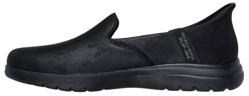 A black slip-on shoe with elastic band on the side.