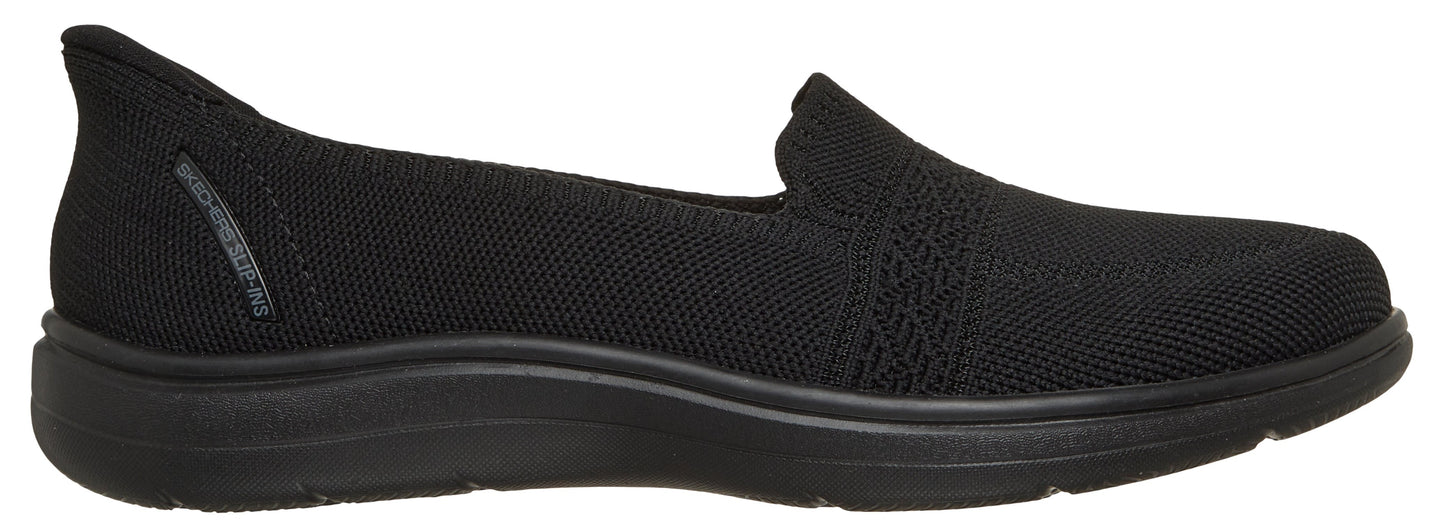 Black knit slip-on shoe.