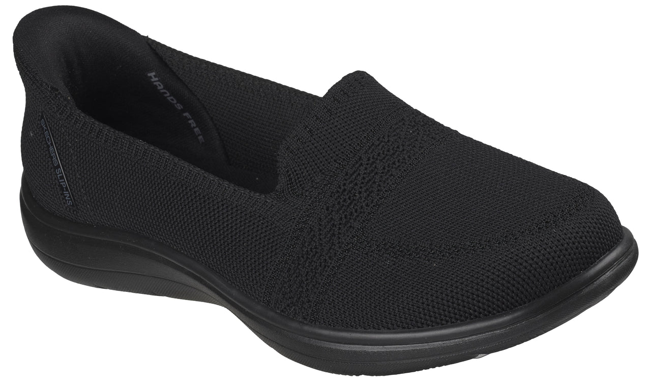 Black slip-on shoe with a rounded toe and a knit upper.