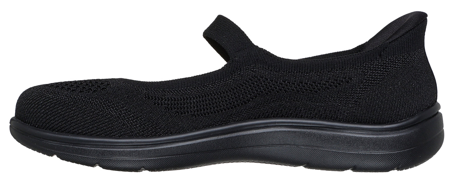 A black women's slip-on mary jane shoe with a strap.