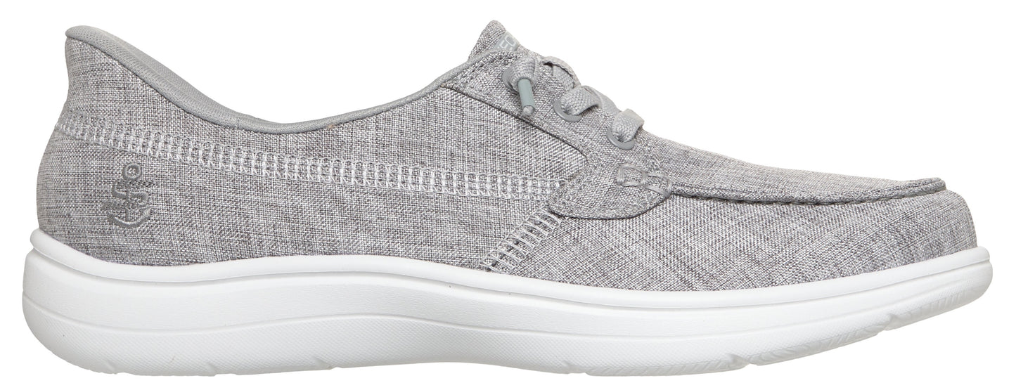 A gray boat shoe with a white sole.