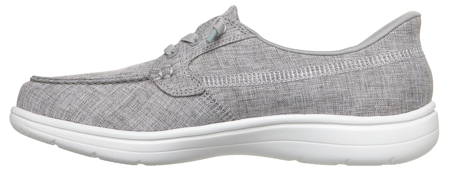 A gray slip-on sneaker with a white sole.