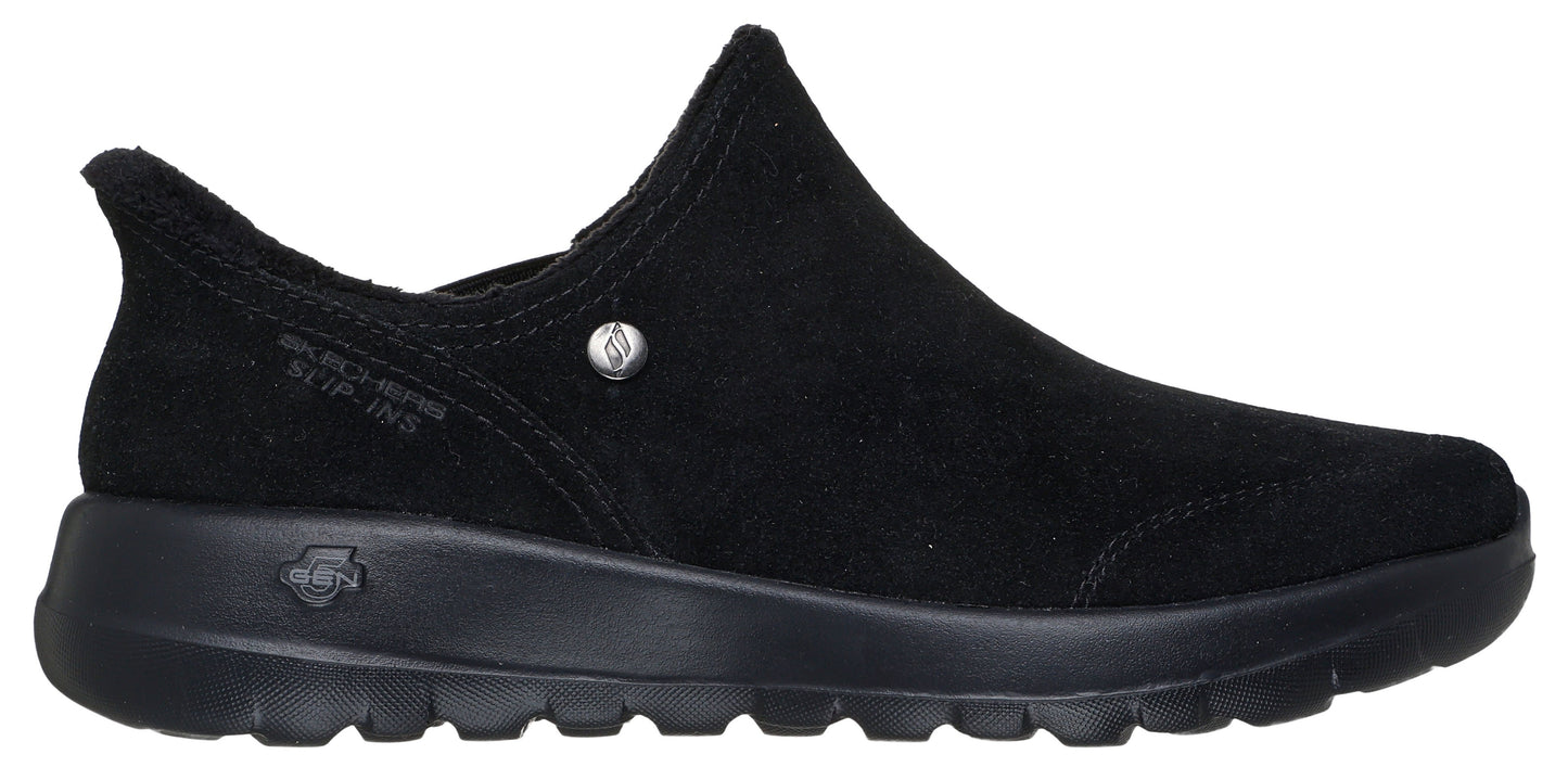 Black slip-on shoe with a rounded toe and a low heel.