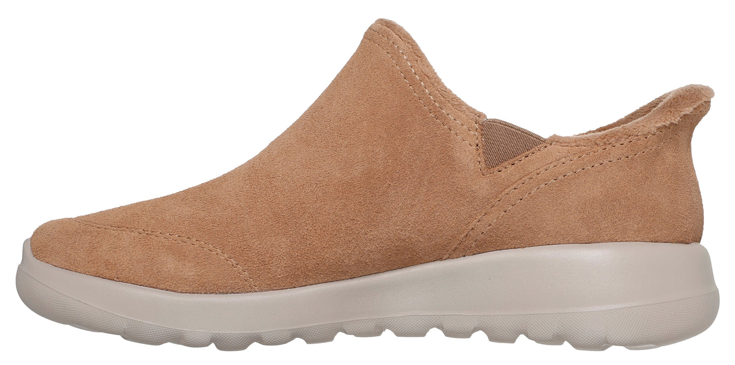 A tan-colored slip-on shoe with a white sole.