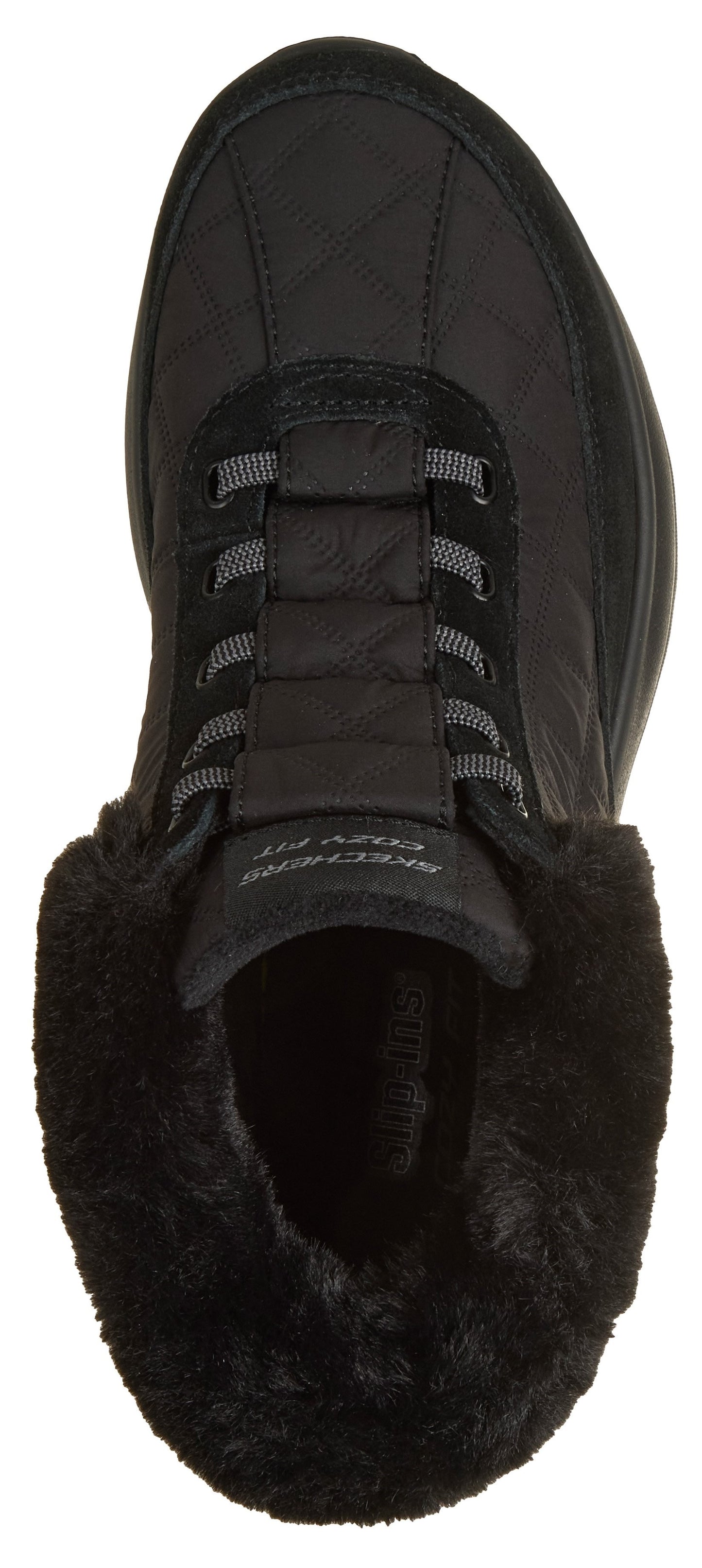 A top-down view of a black slip-on boot featuring a quilted upper, gray elastic lacing, and a plush black faux-fur collar, with the text SKECHERS COZY FIT visible on the tongue.