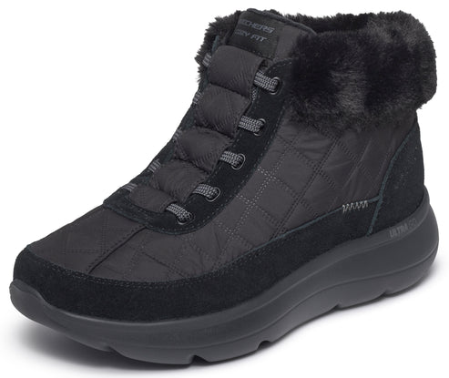 A black ankle-height winter boot with a quilted nylon upper, suede-like overlays on the toe and sides, a thick, rounded sole, and a fluffy faux-fur trim at the cuff, featuring grey laces.