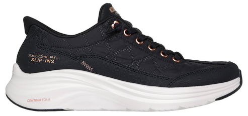 A black sneaker with rose gold details on the laces and logo that says "SKECHERS SLIP-INS".
