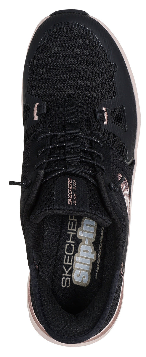 A close-up of a black athletic shoe with mesh material and pink accents.