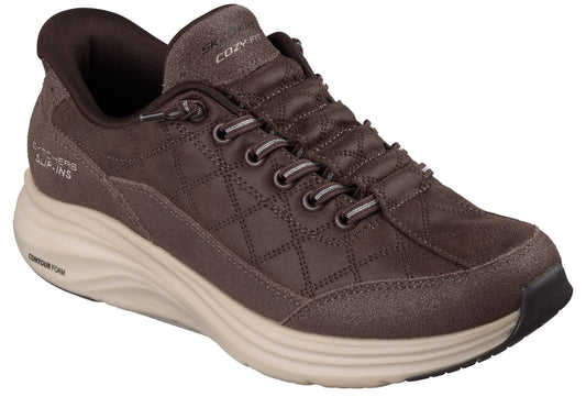 A brown Skechers Hands Free Slip-Ins Cozy Fit women's athletic shoe featuring a quilted upper, bungee laces, and a thick, ridged light-tan Contour Foam midsole.