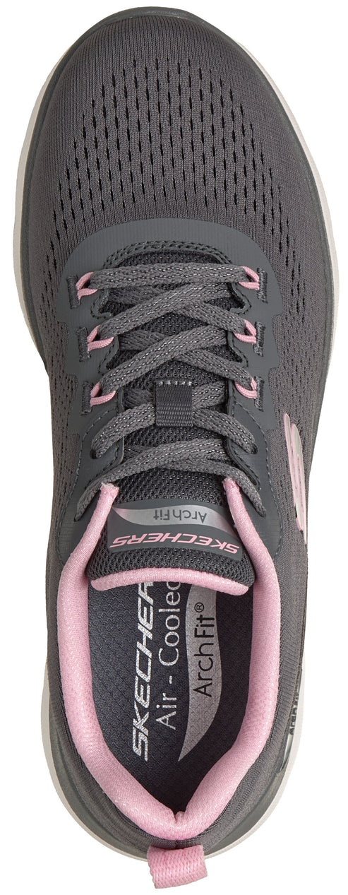 A top-down view of a grey lace-up athletic sneaker with pink accents on the eyelets, tongue, inner lining, and heel tab, featuring text on the tongue and insole that reads SKECHERS and Arch Fit.
