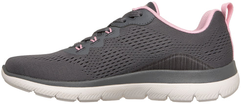 A gray athletic sneaker with a white cushioned sole and pale pink interior lining and heel pull tab.