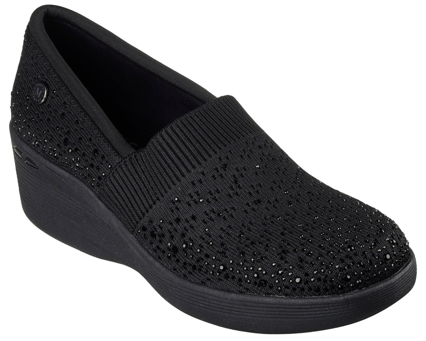 Black slip-on wedge shoe with knit upper and gem embellishments.