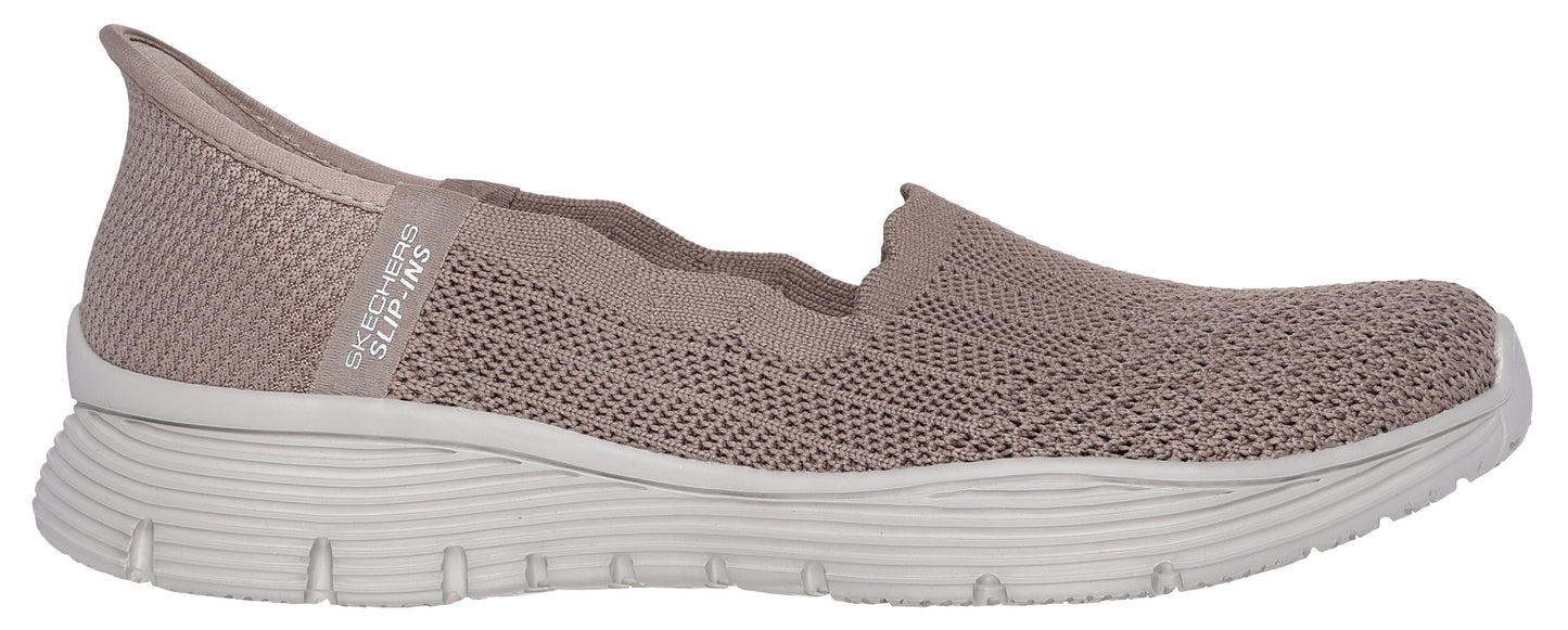 A slip-on knit shoe with a thick white sole.