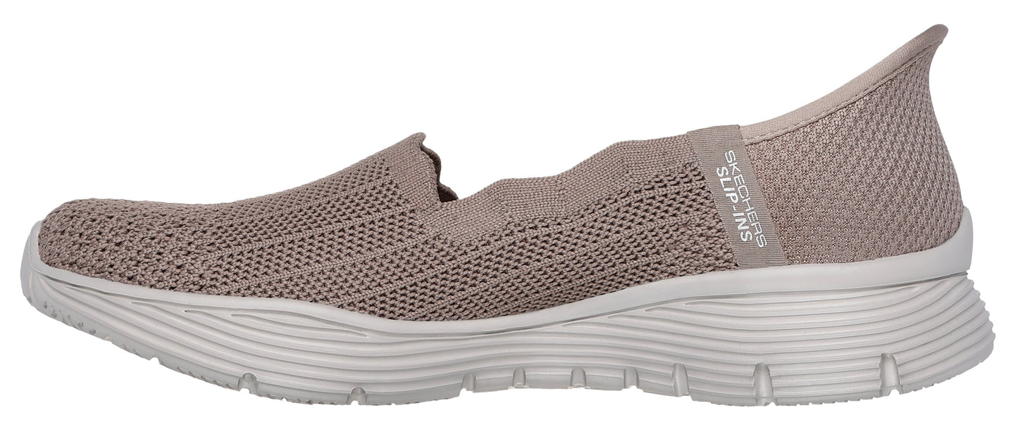 A taupe knit slip-on shoe with a white sole.