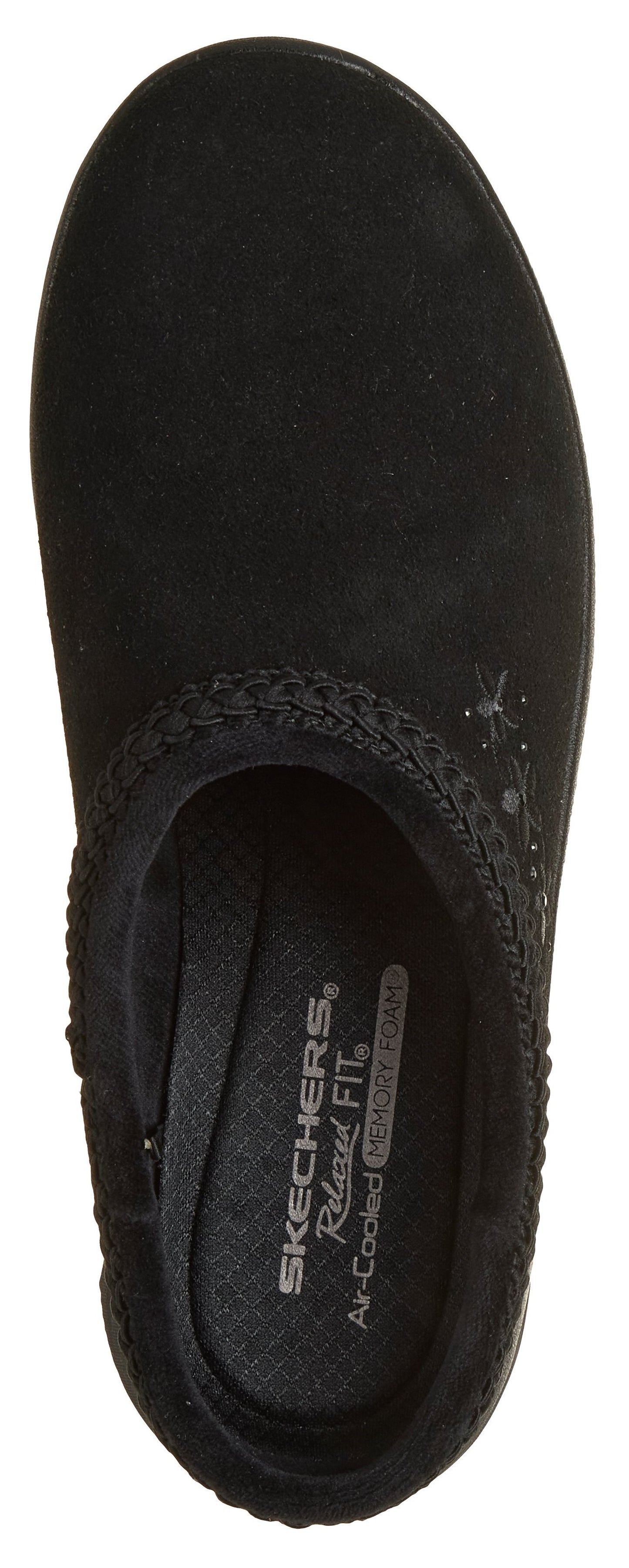 A top-down view of a black, slip-on comfort shoe featuring a braided trim around the collar and subtle stitched embroidery, with a black footbed labeled with the text SKECHERS Relaxed Fit and Air-Cooled Memory Foam.
