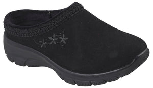 A black slip-on mule shoe made of a suede-like material, featuring a braided trim along the collar and an embroidered design of three small flowers with tiny dots on the outer side, set on a thick black molded rubber sole.