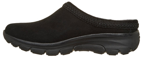 A black slip-on mule shoe with a rounded toe, a textured woven trim along the collar, and a thick, lugged black rubber outsole.