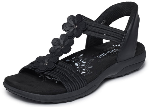 Black sandal with flower embellishments and 'Slip-ins' logo.