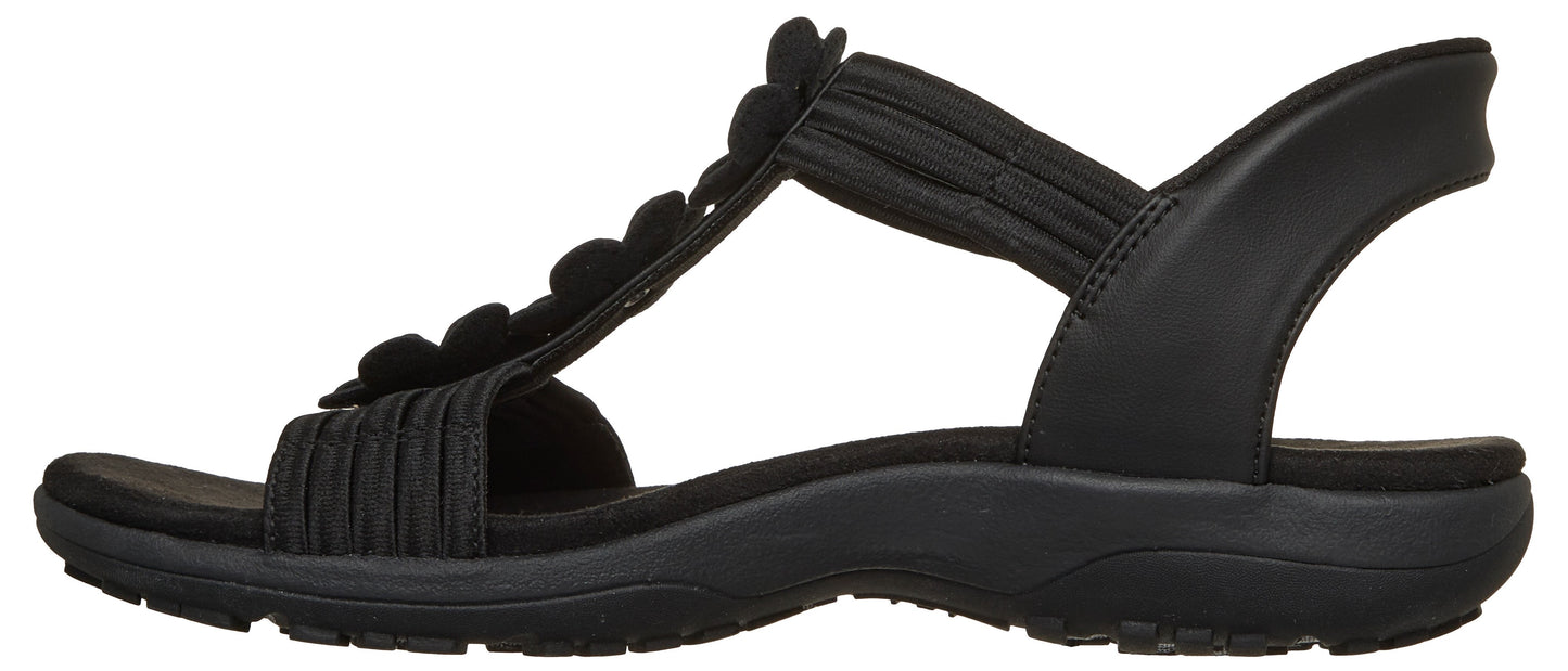 Black sandal with flower detail.