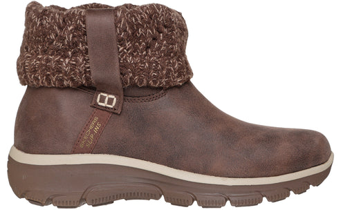 Brown ankle boot featuring a thick knit cuff and buckle.